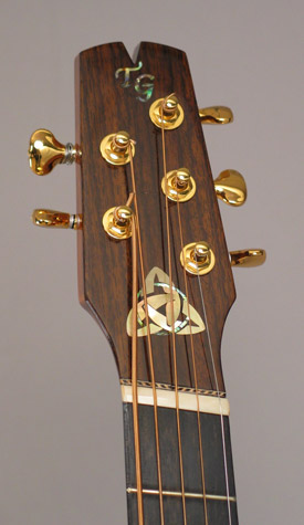 Photo of the headstock of Mandonator 8 with inlay