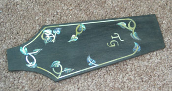 Photo of the headstock veneer with nouveau inlay
