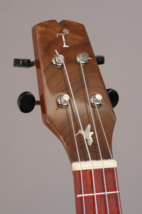 Photo of the headstock of uke 3 with hummingbird inlay