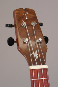 Photo of the headstock of uke 3 with hummingbird inlay
