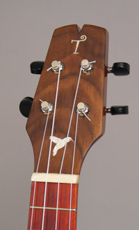 Photo of the headstock of uke 4 with hummingbird inlay